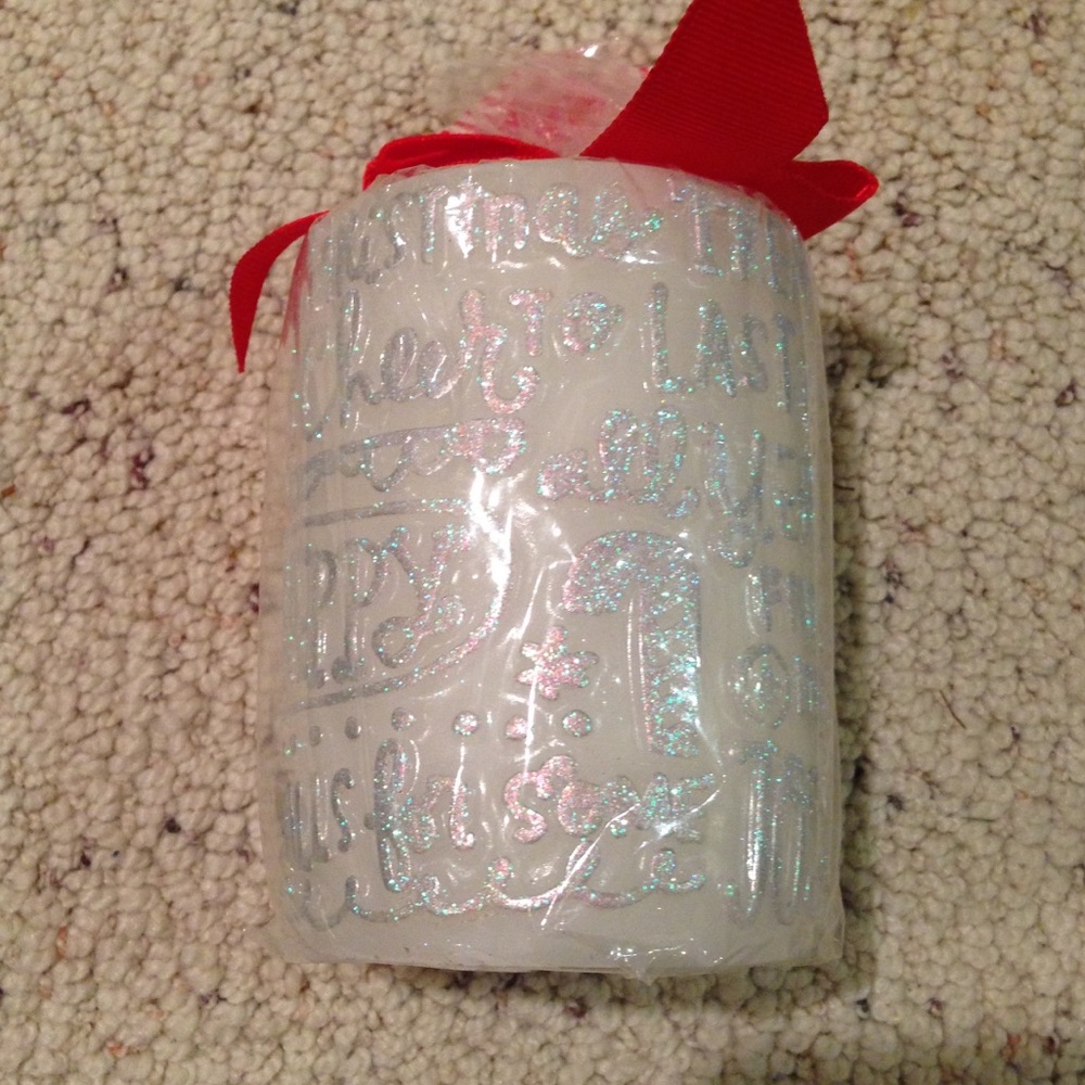 Christmas candle. New in plastic/with tags